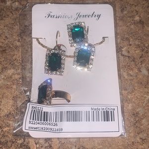 Green and gold rhinestone necklace, earrings, and ring